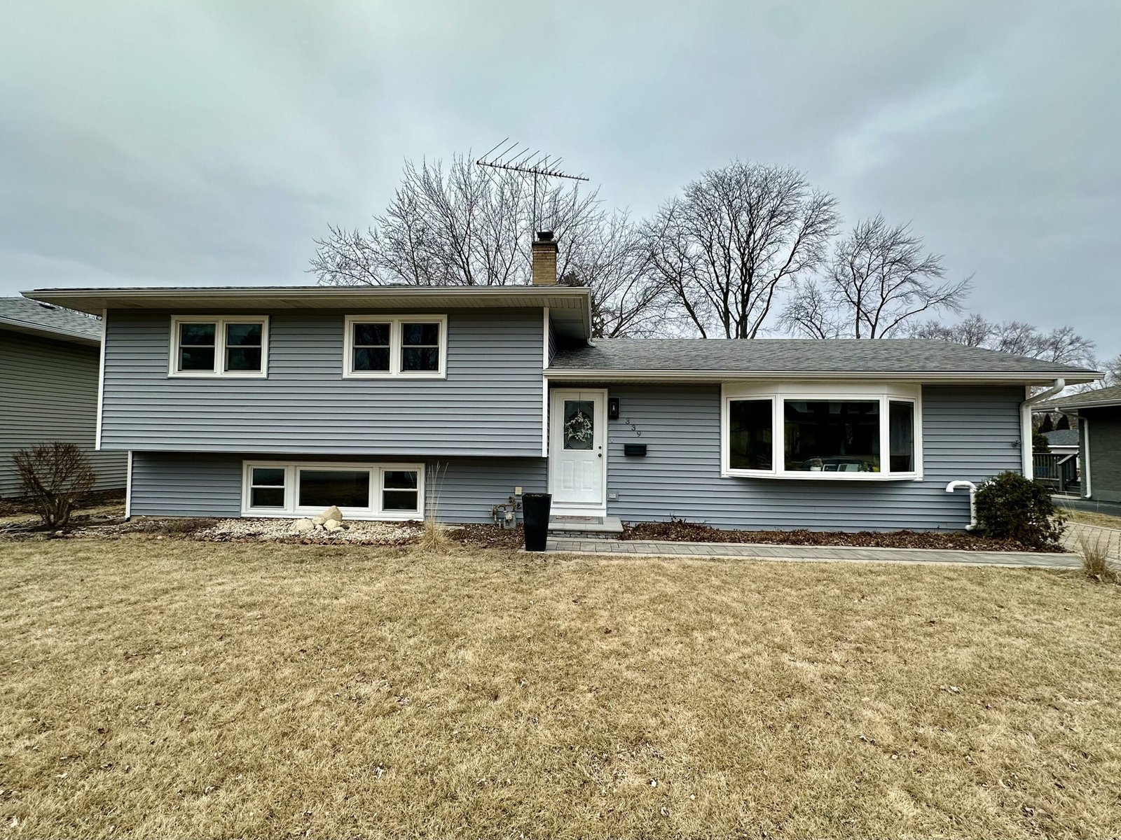 After view of front of house