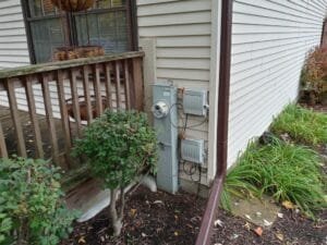 Before view of siding and old wooden windows