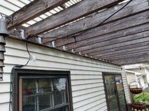 Before view of siding and old wooden windows