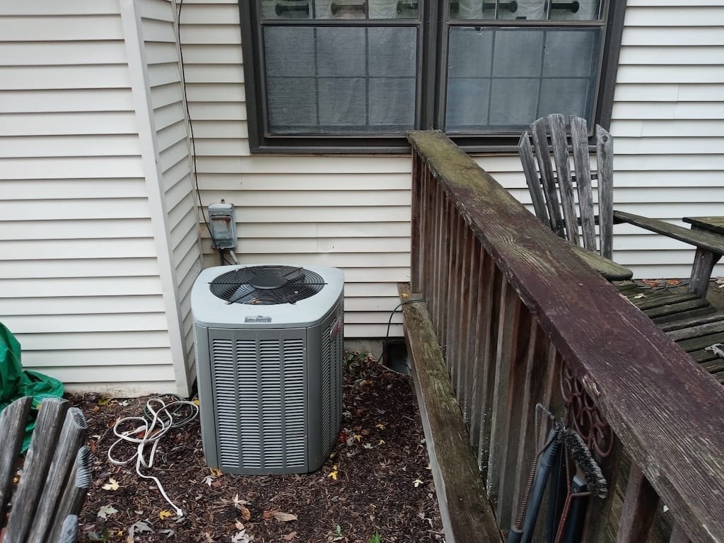 Before view of siding and old wooden windows